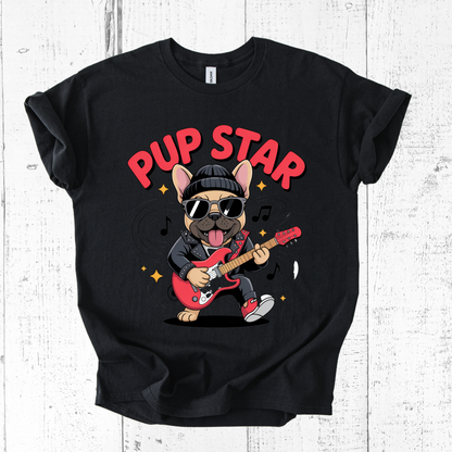 Black t-shirt with a dog playing guitar graphic and 'Pup Star' text on a white wooden background