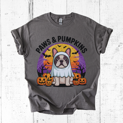 Gray t-shirt with a dog in a costume and 'Paws & Pumpkins' text on a white wooden background