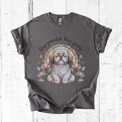 Gray t-shirt with a dog illustration and text on a wooden surface