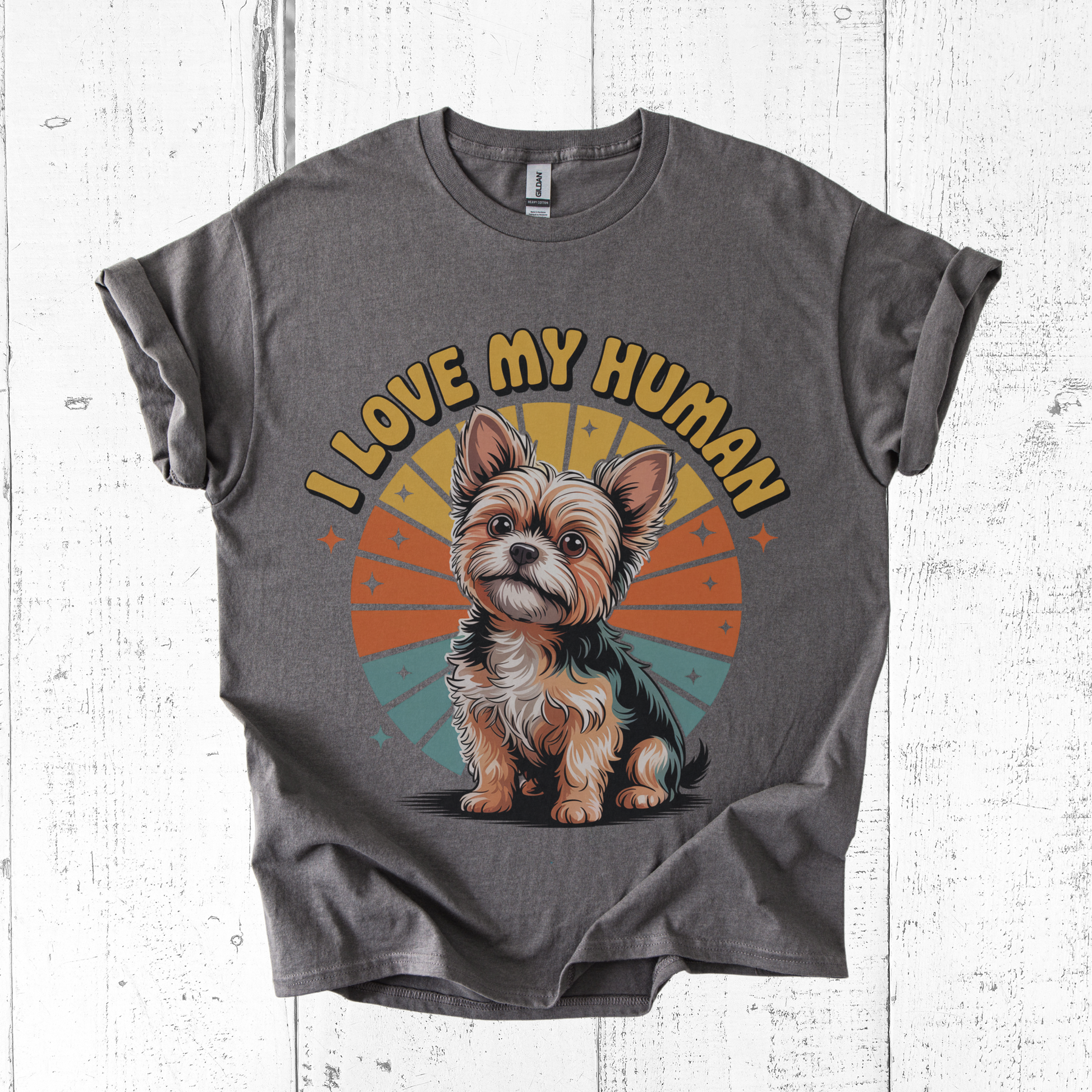 Gray t-shirt with a dog graphic and 'I Love My Human' text on a wooden surface