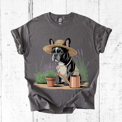 Gray t-shirt with a dog wearing a hat and gardening outfit on a white wooden background