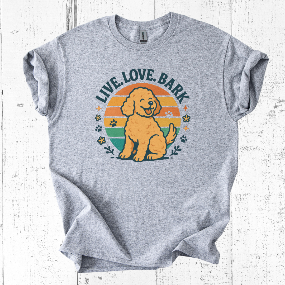 Gray t-shirt with a dog graphic and 'Live. Love. Bark' text on a white wooden background