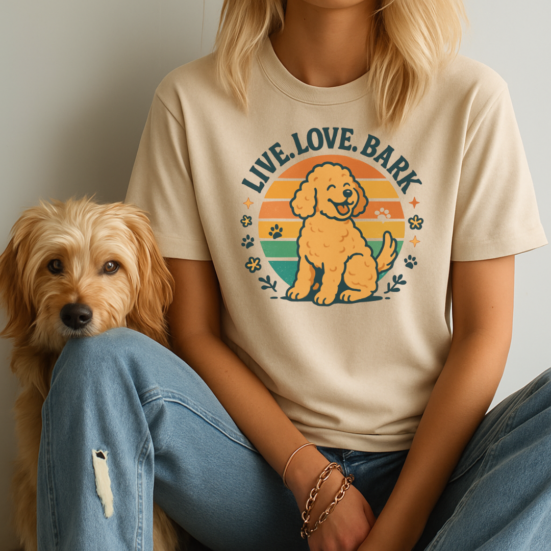 Person wearing a t-shirt with a dog graphic and 'Live. Love. Bark' text, sitting next to a small dog.
