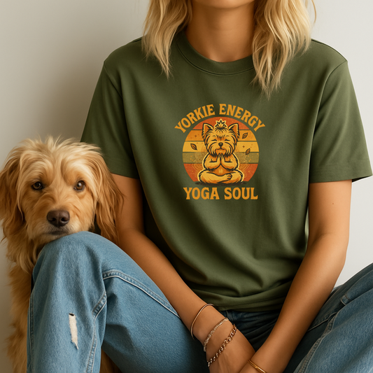 Person wearing a green t-shirt with a dog graphic and text, sitting next to a dog.
