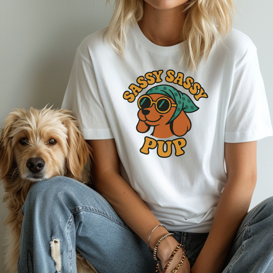 Person wearing a white t-shirt with 'Sassy Sassy Pup' design sitting next to a dog.