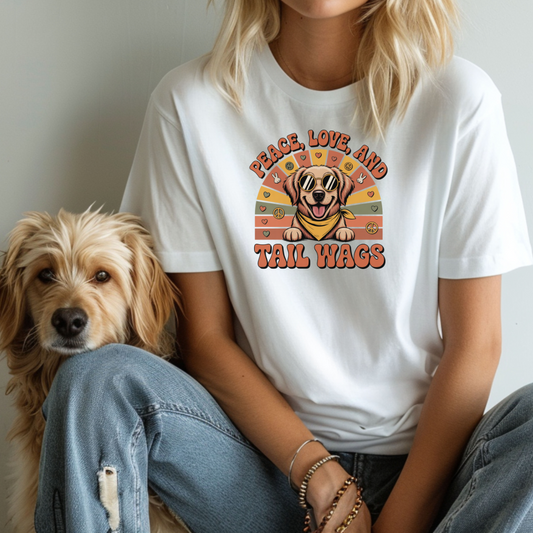 Person wearing a white t-shirt with a dog graphic and text, sitting next to a dog.
