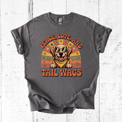 Gray t-shirt with a dog graphic and 'Peace, Love, and Tail Wags' text on a wooden surface