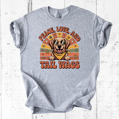 Gray t-shirt with a dog graphic and 'Peace, Love, and Tail Wags' text on a white wooden background