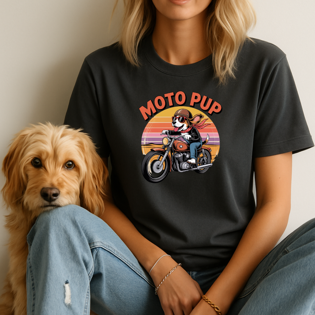 Person wearing a black t-shirt with 'Moto Pup' graphic and a dog sitting next to them.