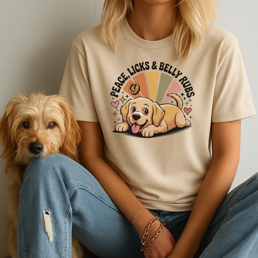 Person wearing a t-shirt with a dog graphic and text, sitting next to a dog.