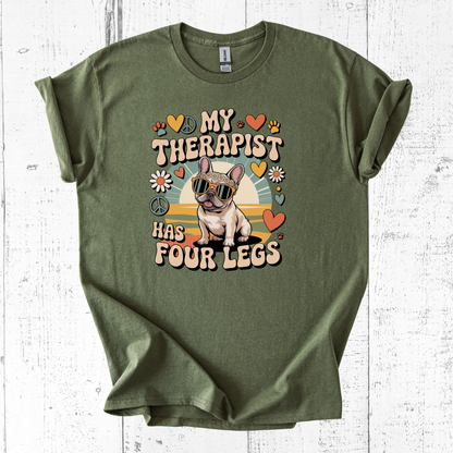Green t-shirt with a dog graphic and text on a white wooden background