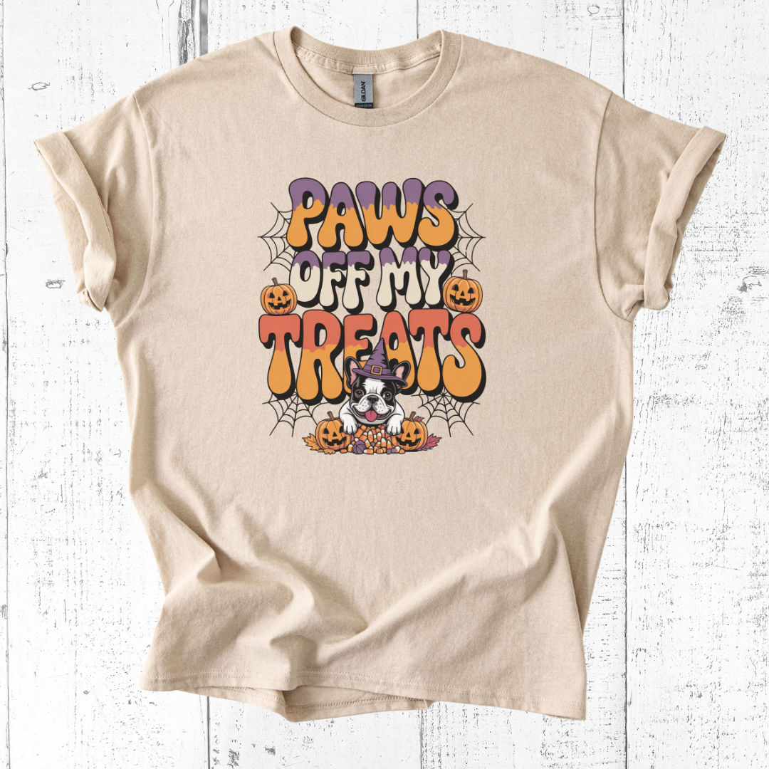 Beige t-shirt with Halloween-themed design featuring a dog and text on a white wooden background