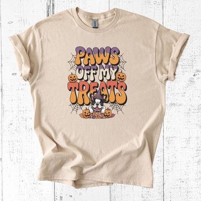 Beige t-shirt with Halloween-themed design featuring a dog and text on a white wooden background