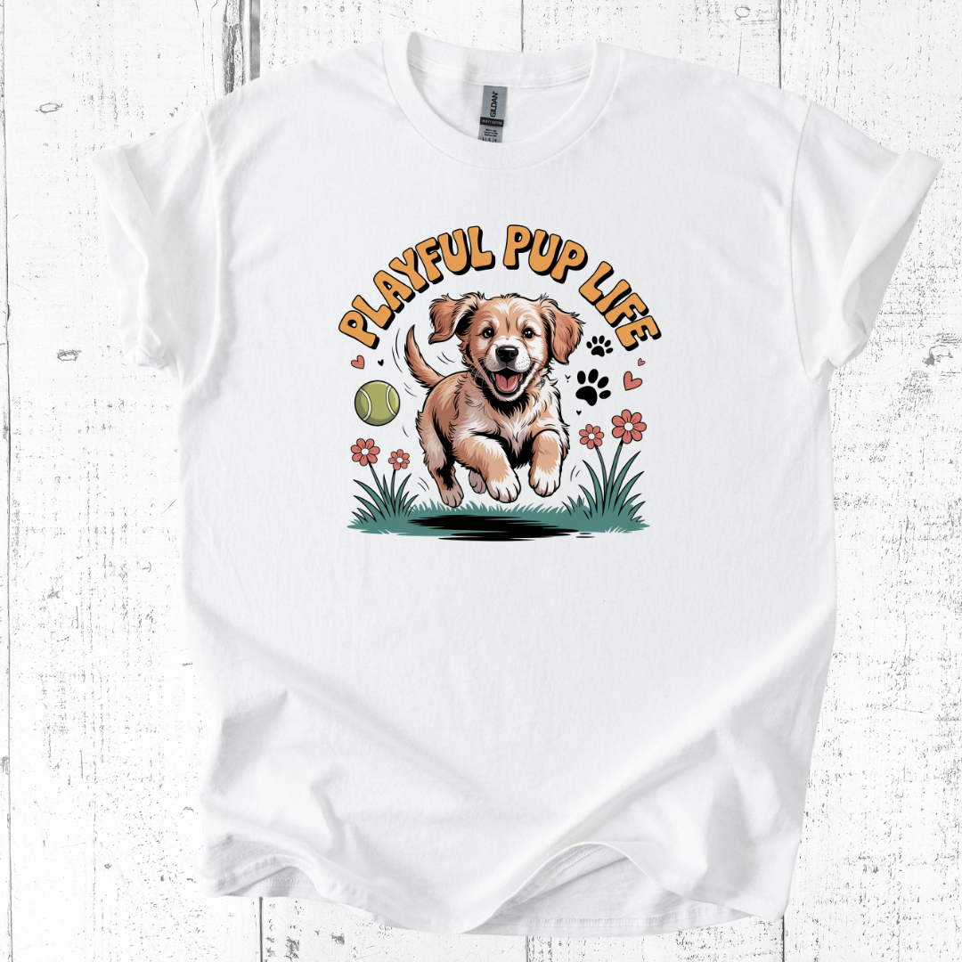 White t-shirt with a graphic of a puppy and 'Playful Pup Life' text on a wooden surface.