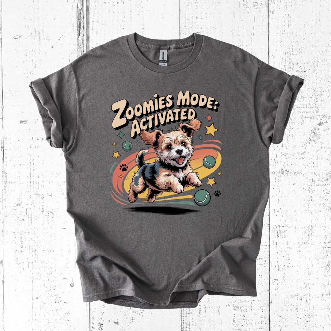 Gray t-shirt with a dog graphic and 'Zoomies Mode: Activated' text on a white wooden background
