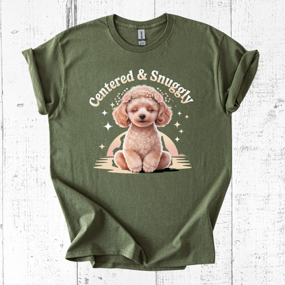 Green t-shirt with a cute dog graphic and 'Centered & Snuggly' text on a white wooden background
