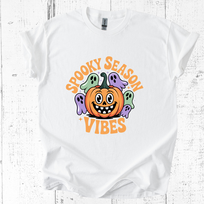 White t-shirt with Halloween-themed design featuring a pumpkin and ghosts on a white background