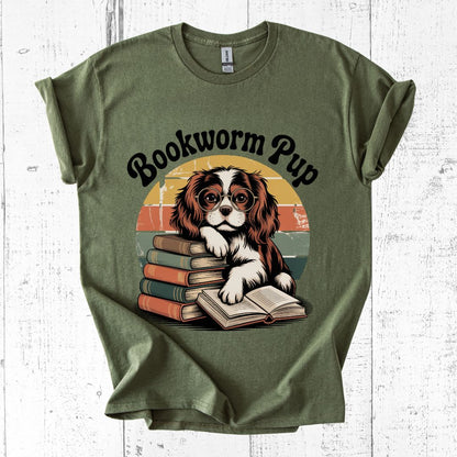 Green t-shirt with a dog graphic and 'Bookworm Pup' text on a white wooden background