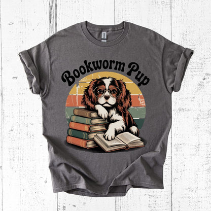 Gray t-shirt with a dog graphic and 'Bookworm Pup' text on a white wooden background