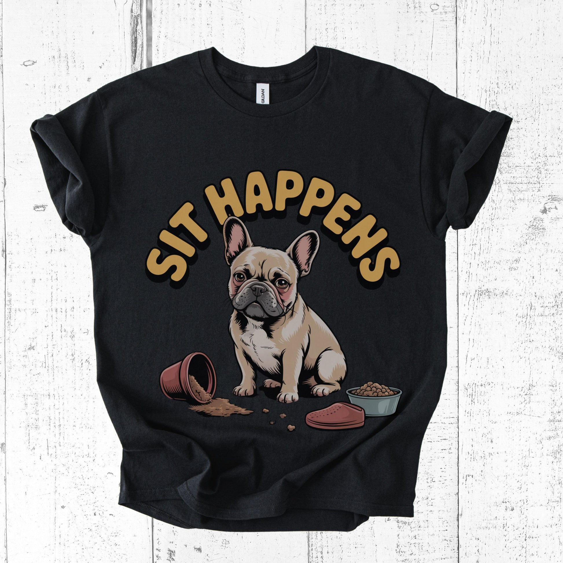 Black t-shirt with a dog graphic and 'Sit Happens' text on a white wooden background