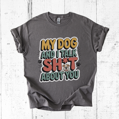 Gray t-shirt with colorful graphic and text on a white wooden background
