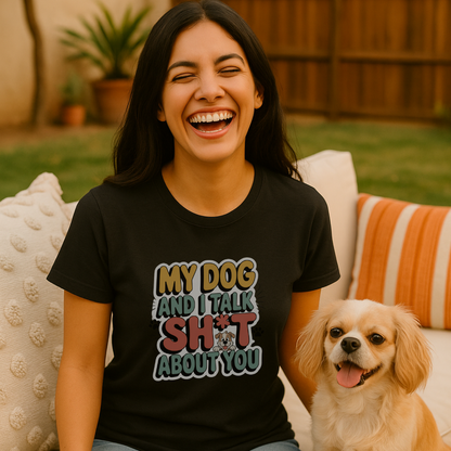 Woman wearing a black t-shirt with a humorous graphic and text, sitting on a couch with a dog next to her.