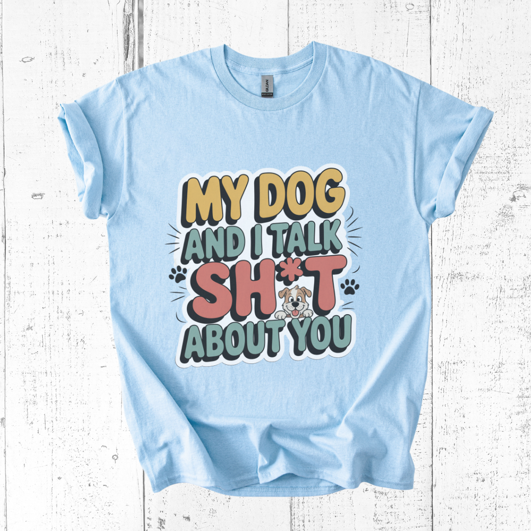 Light blue t-shirt with colorful text design on a wooden surface