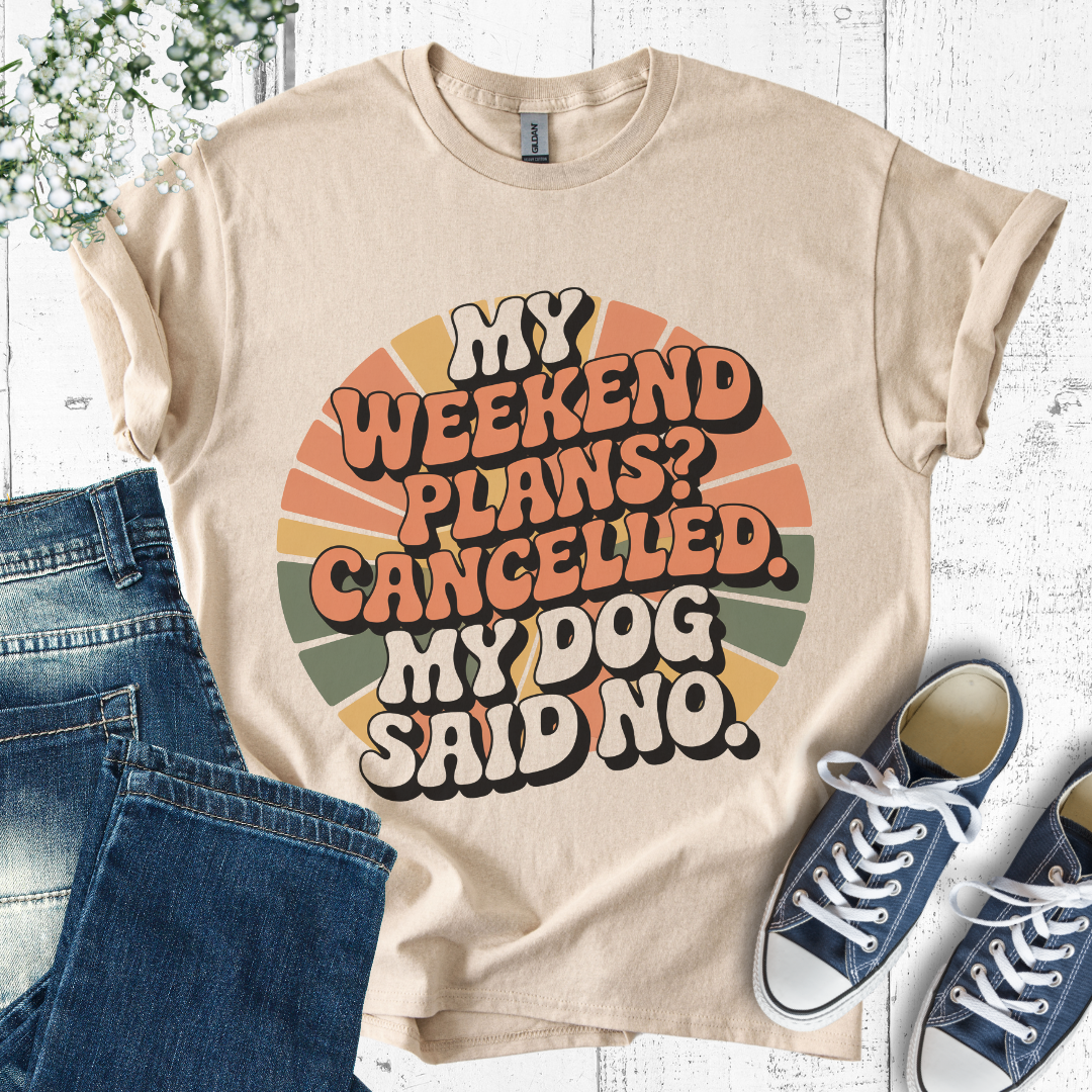 Beige t-shirt with 'My weekend plans? Cancelled. My dog said no.