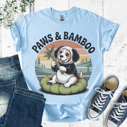 Light blue t-shirt with a dog graphic and 'Paws & Bamboo' text, displayed with jeans and sneakers.