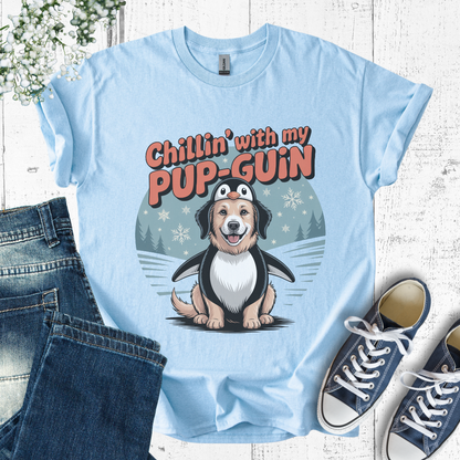 Light blue t-shirt with a cartoon penguin and dog design, text 'Chillin' with my PUP-GUIN', displayed with jeans and sneakers.