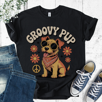 Black t-shirt with 'Groovy Pup' design featuring a dog, flowers, and peace signs, displayed with jeans and sneakers.