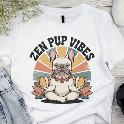 White t-shirt with a dog illustration and 'Zen Pup Vibes' text on a wooden surface.
