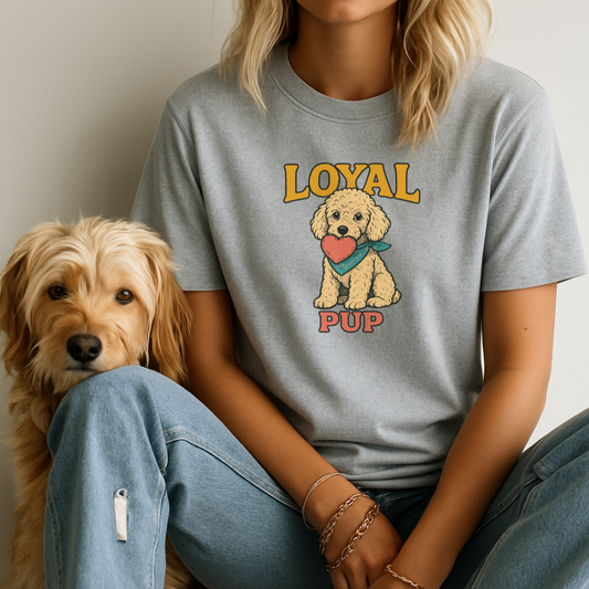 Person wearing a gray t-shirt with a dog graphic and 'Loyal Pup' text, sitting next to a dog.