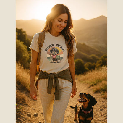 Unisex t-shirt with retro dog graphic and ‘Wag More, Hike More.’ text, perfect for dog lovers.