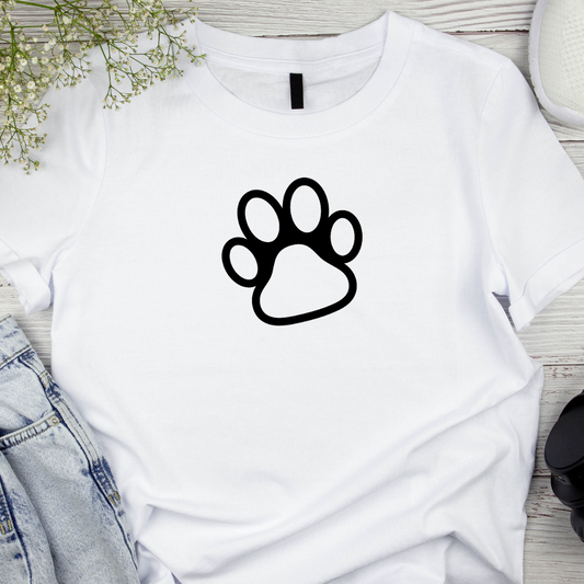 White t-shirt with a black paw print design on a wooden surface.