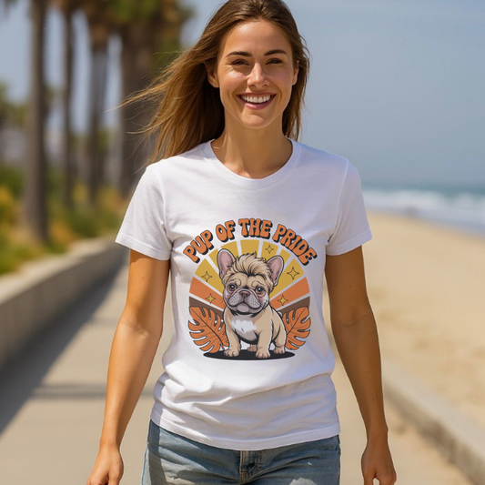 Woman wearing a white t-shirt with a dog graphic and text on a beach.
