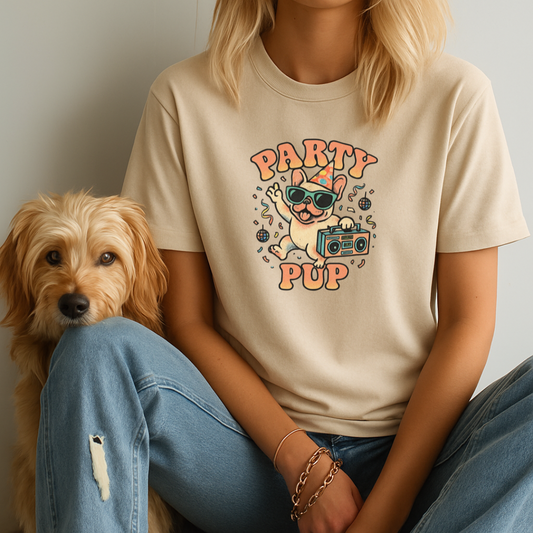 Person wearing a 'Party Pup' t-shirt with a dog sitting next to them.