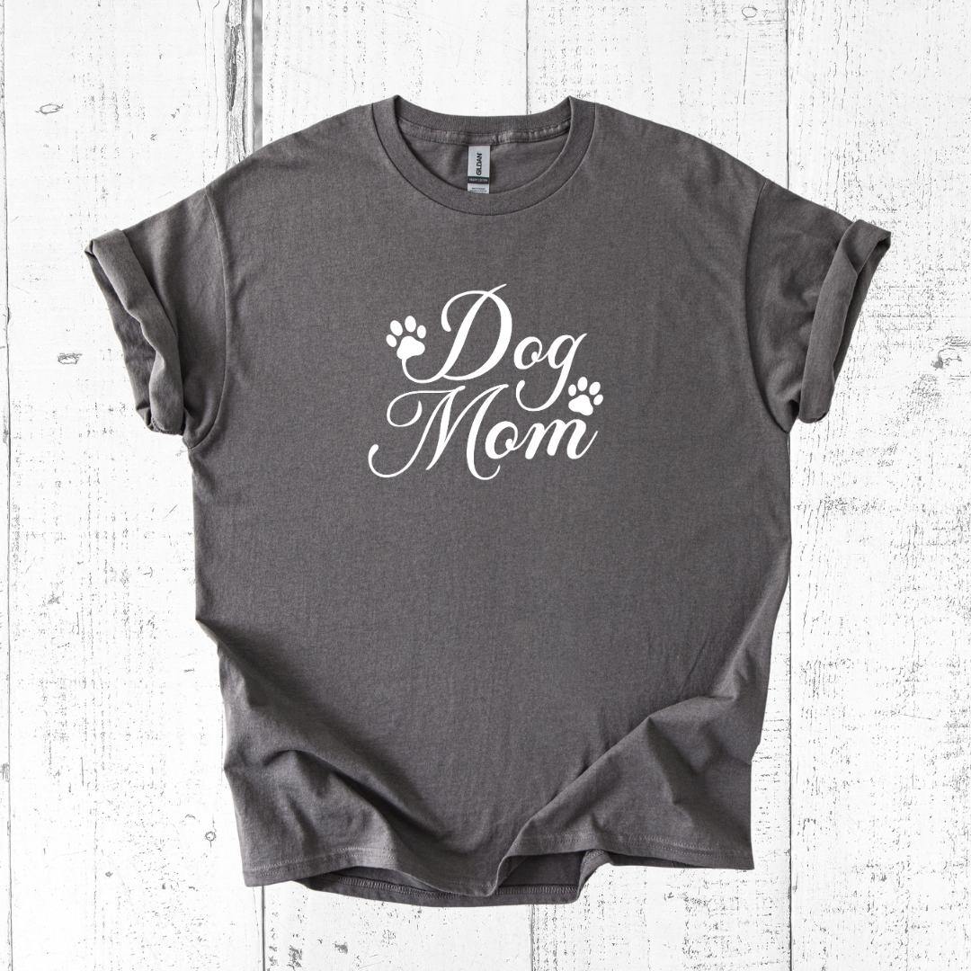 Gray t-shirt with 'Dog Mom' text on a white wooden surface