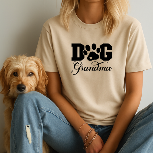 Person wearing a 'Dog Grandma' t-shirt sitting next to a dog.