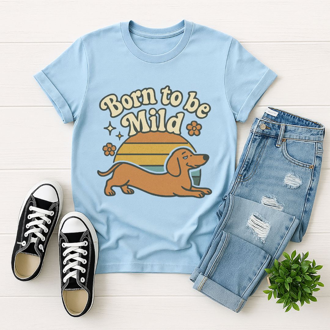 Light Blue Gildan 6400 unisex t-shirt with retro dog graphic and ‘Born To Be Mild’ text, perfect for dog lovers.
