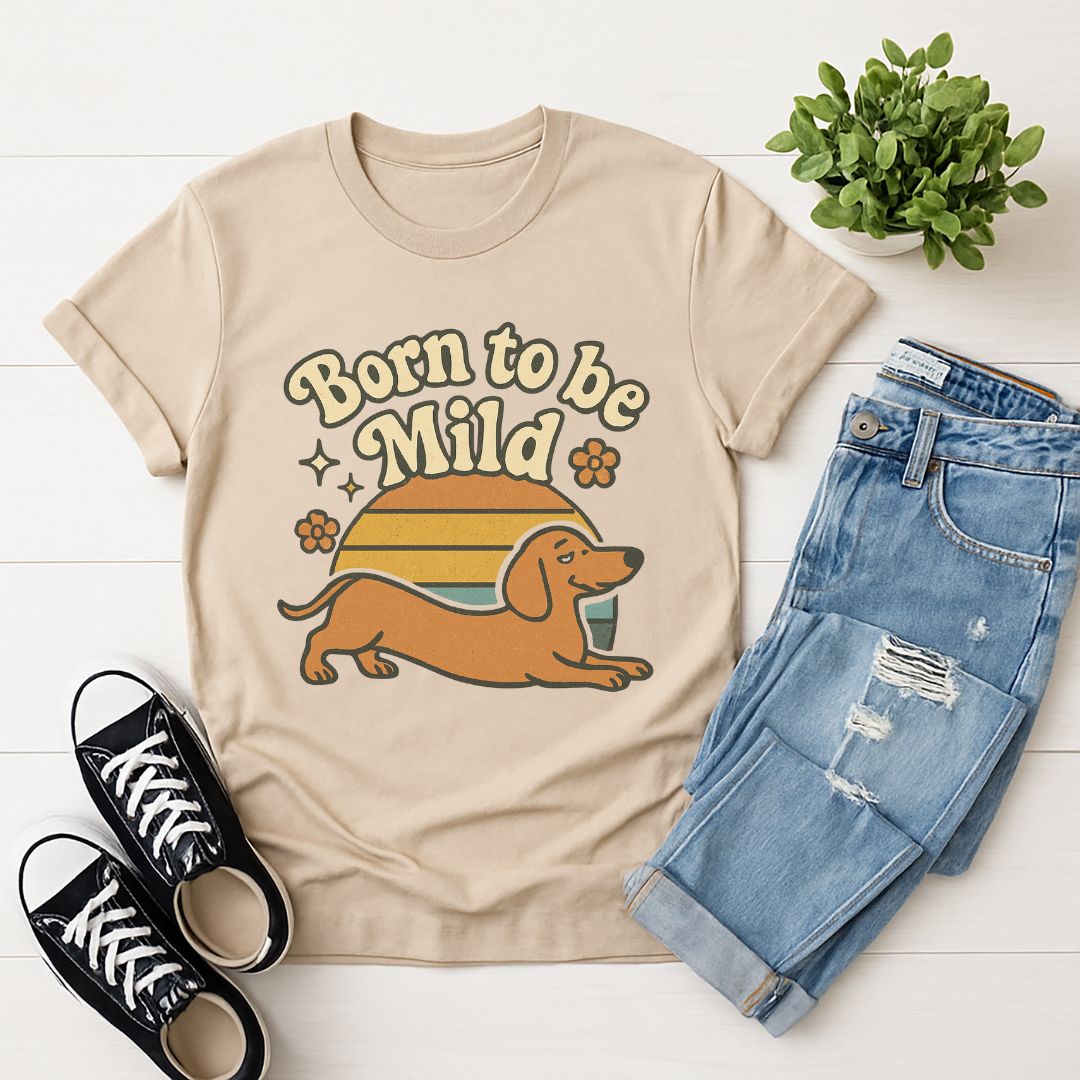 Sand Beige Gildan 6400 unisex t-shirt with retro dog graphic and ‘Born To Be Mild’ text, perfect for dog lovers.