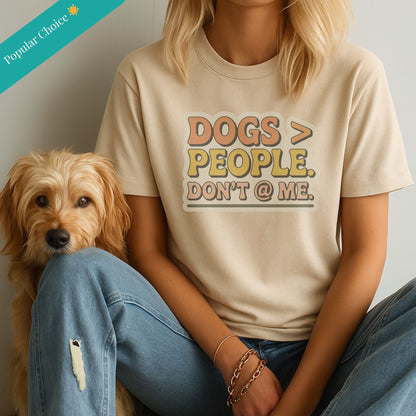 Sand Beige Gildan 6400 unisex t-shirt with retro dog graphic and ‘Dogs > People. Don't @ Me’ text, perfect for dog lovers.