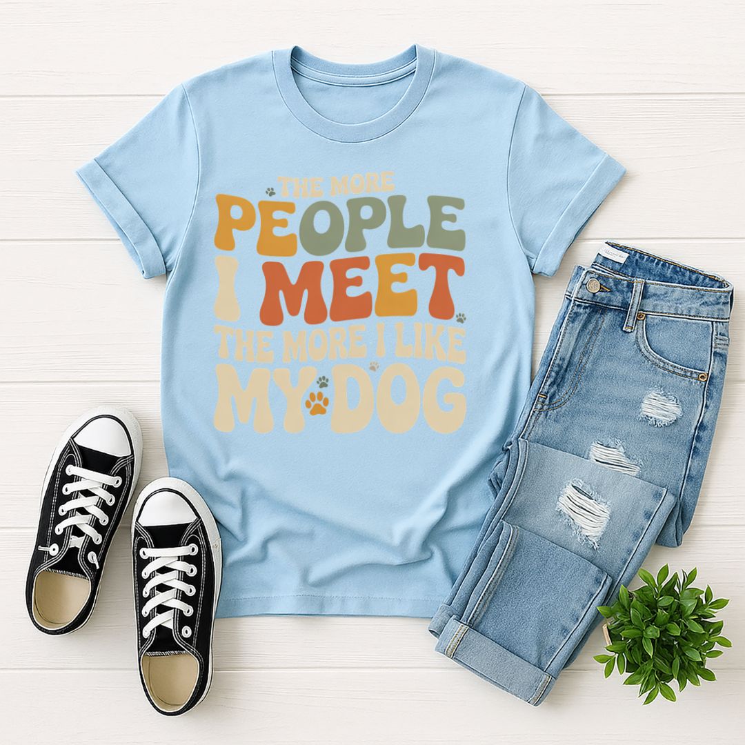 Light Blue Gildan 6400 unisex t-shirt with retro dog graphic and ‘The More People I Meet The More I Like My Dog’ text, perfect for dog lovers.