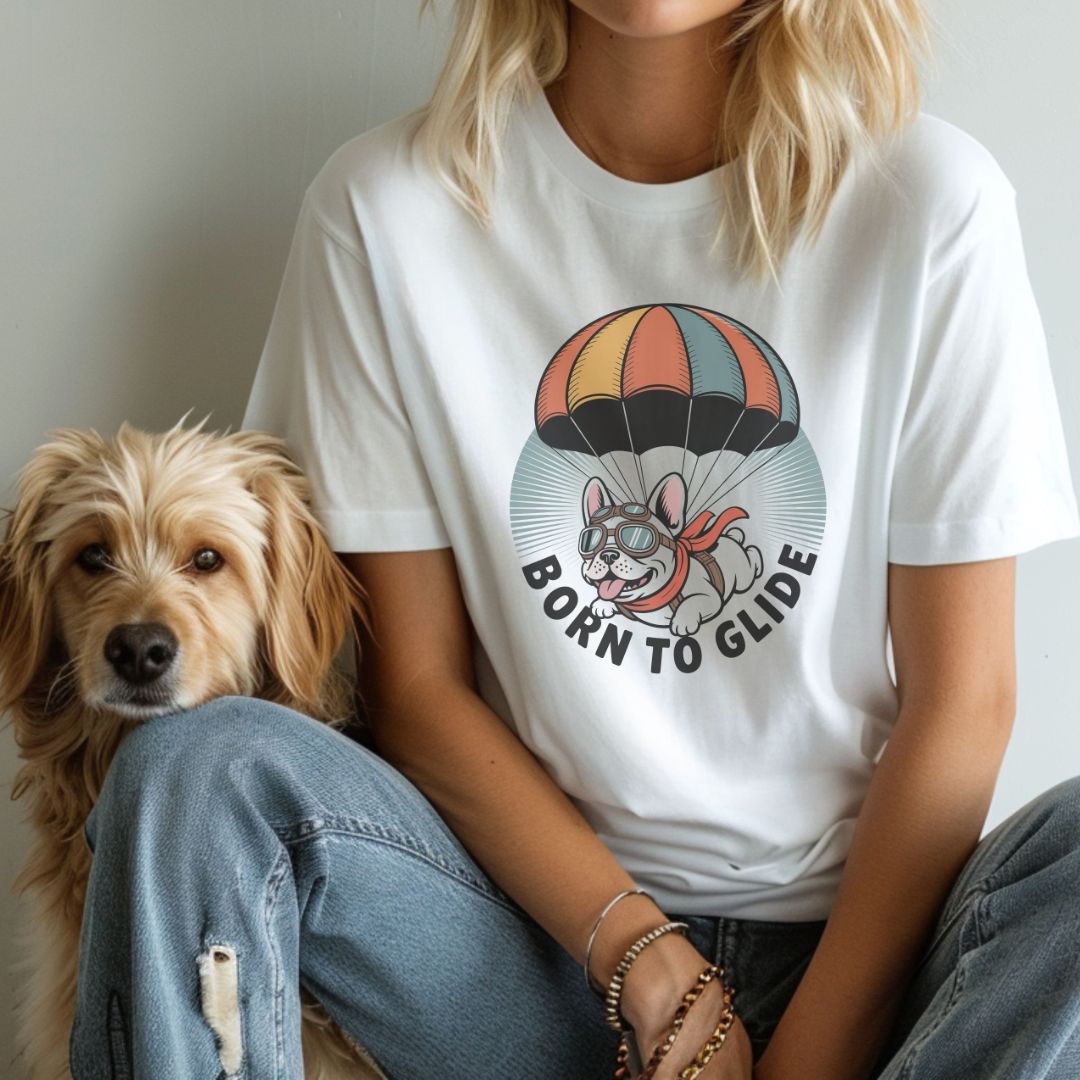 White unisex t-shirt with retro dog graphic and ‘Born To Glide.’ text, perfect for dog lovers.