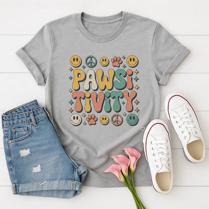 Sport Gray Gildan 6400 unisex t-shirt with retro dog graphic and ‘Pawsitivity' text, perfect for dog lovers.