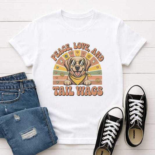 White Gildan 6400 unisex t-shirt with retro dog graphic and ‘Peace, Love And Tail Wags’ text, perfect for dog lovers.