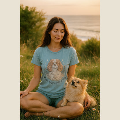 Light Blue unisex t-shirt with retro dog graphic and ‘Peace begins with a wag’ text, perfect for dog lovers.