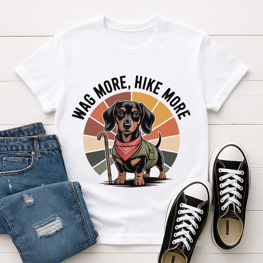 White Gildan 6400 unisex t-shirt with retro dog graphic and ‘Wag More, Hike More.’ text, perfect for dog lovers.