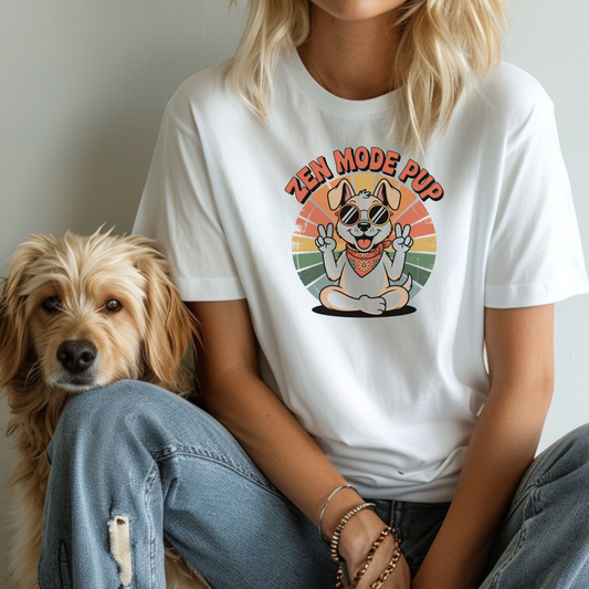 Person wearing a white t-shirt with 'Zen Mode Pup' graphic and a dog sitting next to them.