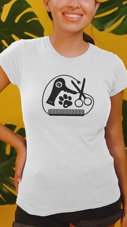 Video showcasing Unisex cotton graphic t-shirt with pet grooming design, on model with grooming tools.